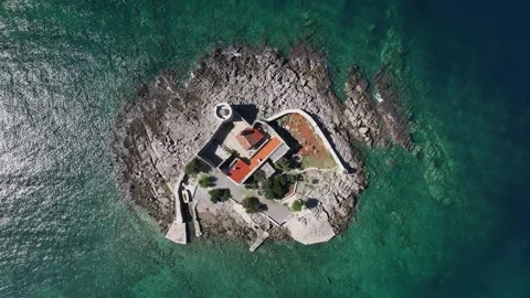 Explore the stunning aerial view of Otocic Gospa, a serene island featuring Stock Footage 287787155