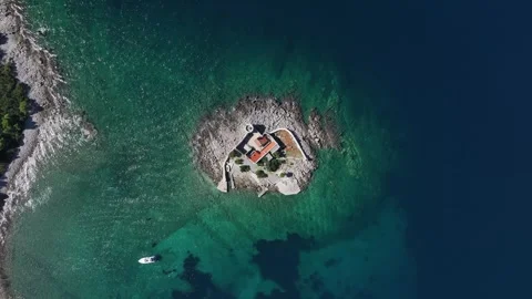 Explore the stunning aerial view of Otocic Gospa, a picturesque island in the Video stock 287787334