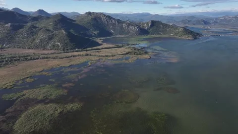 Explore the stunning aerial view of Skadar Lake showcasing its diverse landscape Stock Footage 287792251