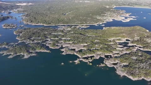 Explore the stunning aerial view of Slansko Lake showcasing its unique islands Video stock 287793622