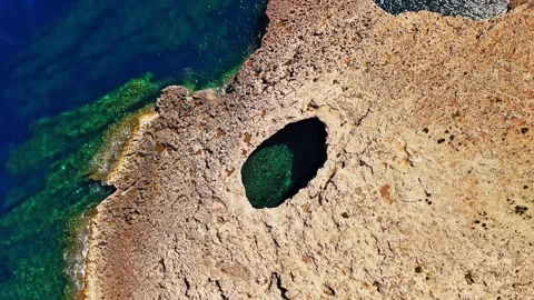 Explore the stunning azure waters and rocky coastline of Malta Stock Footage 306639532