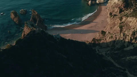 Explore the stunning beach coast with rocks and waves from above Stock Footage 321491257