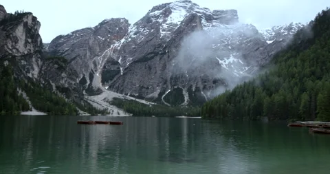 Explore the stunning beauty of alpine mountains and tranquil lakes in the heart Video stock 314082750