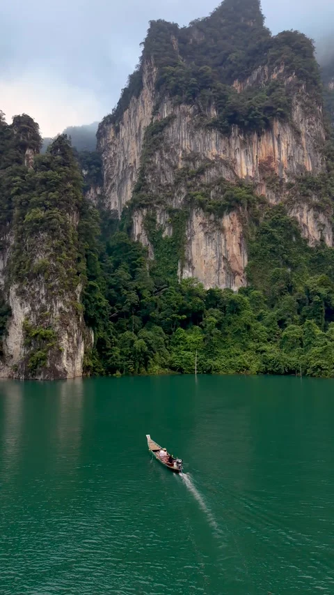 Explore the stunning beauty of Khao Sok National Parks emerald waters and Stock Footage 333096503