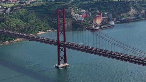 Explore the stunning beauty of Lisbons iconic bridge and waterfront Stock Footage 334086525