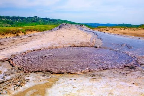 Explore the stunning Berca Mud Volcanoes,a unique geological and botanical 写真素材