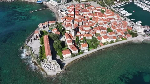 Explore the stunning coastal town with its vibrant rooftops and crystal-clear Video stock 287759302