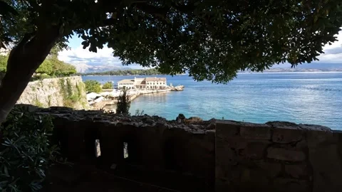 Explore the stunning coastline of Corfu, Greece on a sunny afternoon by the sea Video stock 285596213