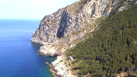 Explore the stunning coastline of Mallorca at Coll Baix near Puerto de Alcudia Stock Footage 305049405