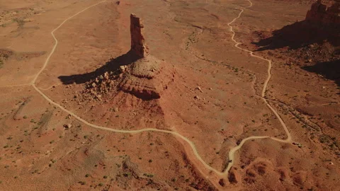 Explore stunning desert rock formations along winding sandstone roads in a Stock Footage 288310572