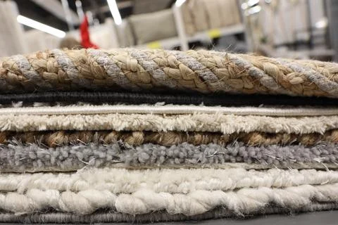 Explore the stunning display of textured area rugs showcased at the home decor 写真素材