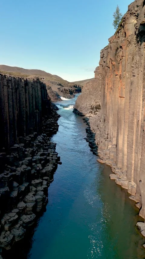 Explore the stunning formations of Studlagil Canyon in Icelands natural paradise Stock Footage 320290483