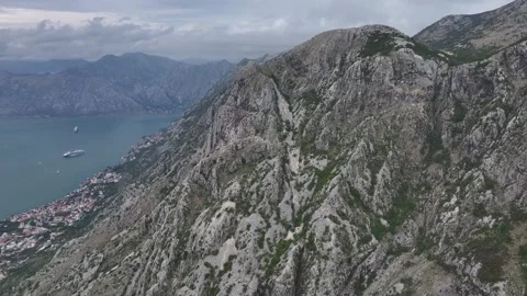 Explore the stunning Kotor Bay landscape with rocky mountains and a panoramic Stock Footage 287774105