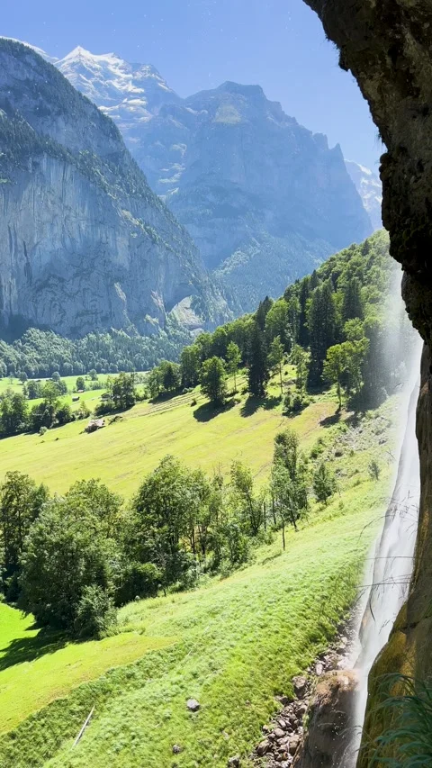 Explore a stunning mountain landscape full of greenery, serene sights, and a Stock Footage 304780687