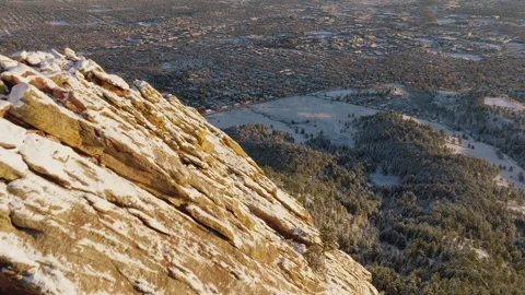 Explore the stunning mountain rocks and forest town during winter's magic Stock Footage 288900964