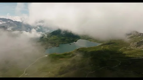 Explore stunning mountain views and clear lakes in a serene setting Stock Footage 320319782