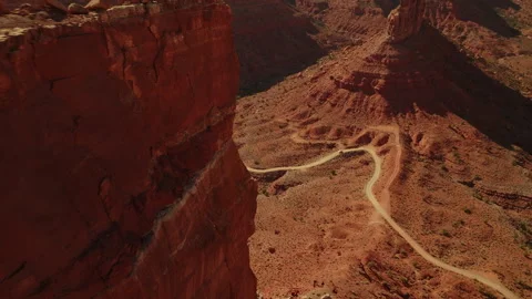 Explore the stunning rock formations and winding roads in Utah's desert Stock Footage 288303021
