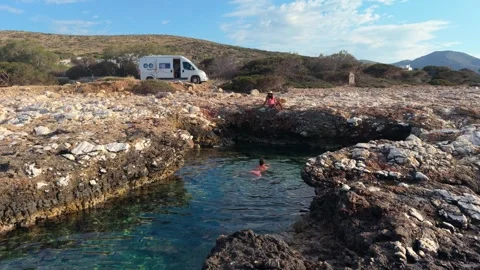 Explore the stunning rock formations and clear waters of Paros Island in Greece Stock Footage 337359319