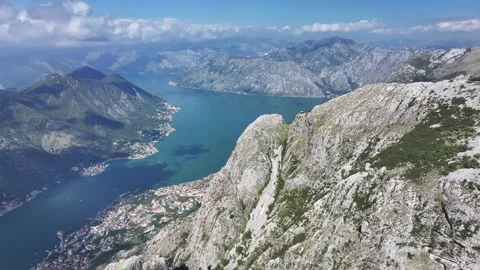 Explore the stunning views of Kotor Bay from the mountain peaks on a sunny day Stock Footage 287774356