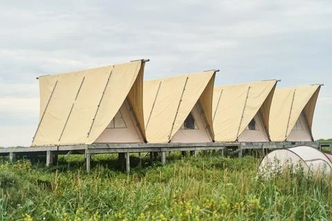 Explore Stylish Beach Structures Featuring Unique Sail Designs That Mesmerize Stock Photos