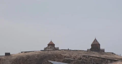 Explore the timeless beauty of an ancient monastery perched atop a hill Stock Footage 252465543