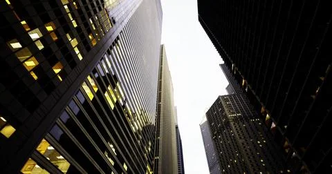 Explore the towering skyscrapers reflecting evening light in the city Stock Illustration