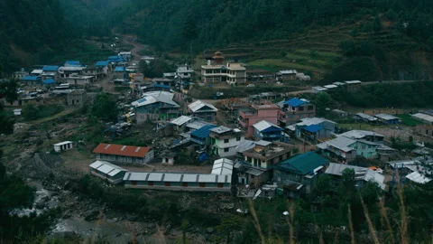Explore the tranquil forest village by the river at dusk Stock Footage 321376778