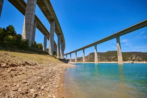 Explore the tranquil scene under the bridge Viaducto de Contreras through res Stock Photos