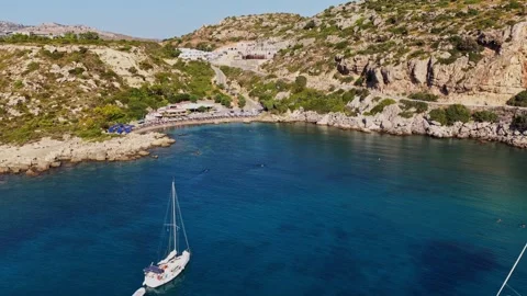 Explore the tranquil waters of Rhodes with stunning aerial views Stock Footage 318017630