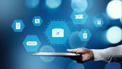 Explore travel booking options using a tablet with many icons related to travel Stock Photos