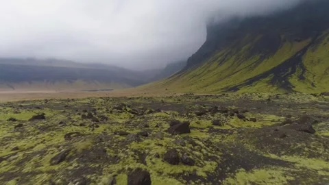 Explore a unique landscape in Iceland with mossy ground and clouds Stock Footage 320293499