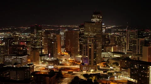 Explore vibrant city lights and skyscrapers across urban landscapes in the USA Stock Footage 288863668