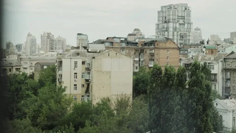 Explore a vibrant cityscape showcasing urban life and nature Stock Footage 308395613