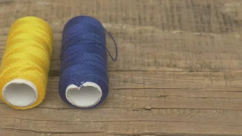 Explore a Vibrant Collection of Colorful Spools of Thread Perfect for Your 스톡 동영상 287454790