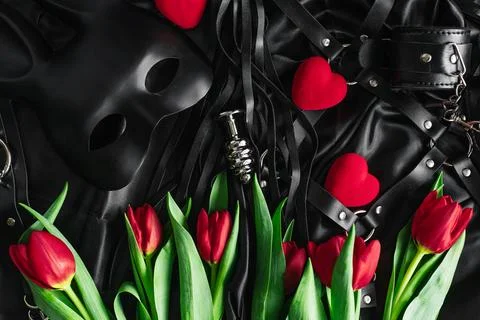 Explore the world of kinky play. Top view of bdsm leather kit whips, handcuff Stock Photos