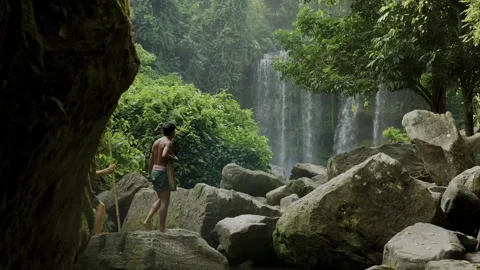 Explorer and local guide trekking near Kulen waterfall in Cambodia Vídeo Stock 331947176