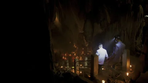 Explorer discovering an ancient underground cave Stock Footage 331952887