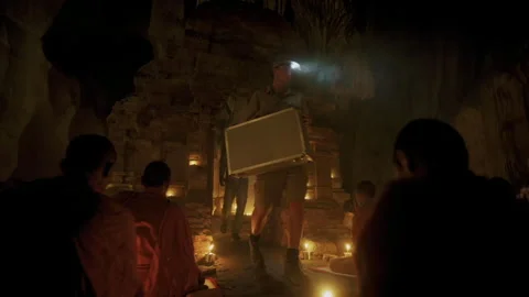 Explorer discovering a hidden temple in a cave with monks Vídeo Stock 331953124