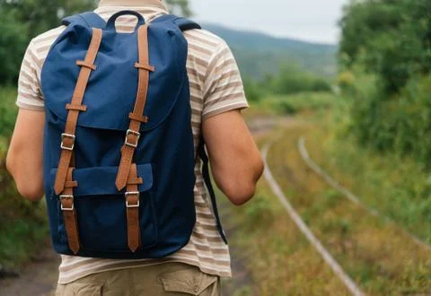Explorer man going on path in summer. Stock Photos