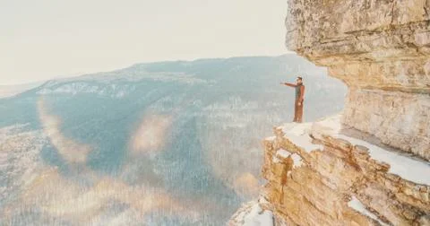 Explorer man standing on cliff Eagle shelf Stock Photos