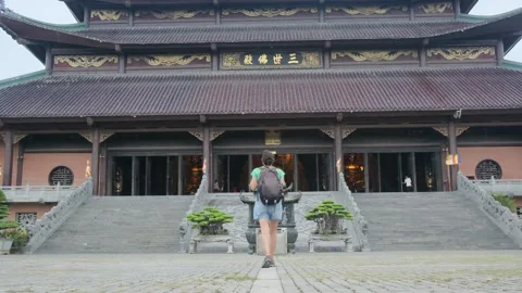 Explorer, navigating the enigmatic Southeast Asian temples Stock Footage 248514004