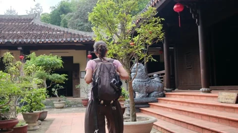 Explorer, navigating the enigmatic Southeast Asian temples Stock Footage 248525588