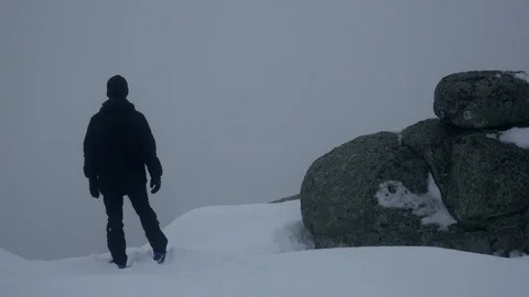 Explorer raises his arms at the top of the mountain Stock Footage 88802680