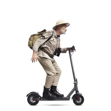 Explorer riding a fast e-scooter Stock-Fotos