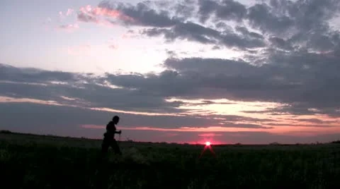 Explorer trek across sunset Video stock 11520754