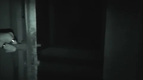 Explorer of the unknown opens door on dark nothing Stockbeeldmateriaal 100513359