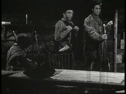 Explorer William Clark helps a private clean his musket at Camp Dubois, in Wood Stock Footage 79467557