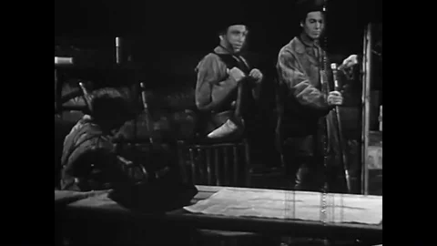 Explorer William Clark helps a private clean his musket at Camp Dubois, in Wood Stock Footage 85768068