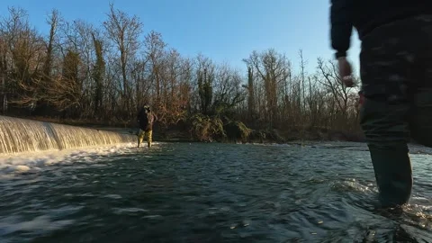 Explorers wading a river in the park Stock Footage 283681079
