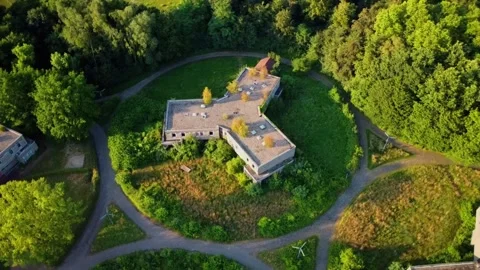 Exploring an abandoned building in the forest during daytime Stock Footage 339783110